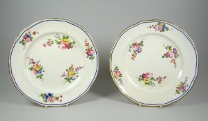 A PAIR OF NANTGARW PORCELAIN PLATES of lobed form with six internal sprays of flowers within a