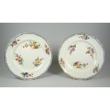 A PAIR OF NANTGARW PORCELAIN PLATES of lobed form with six internal sprays of flowers within a