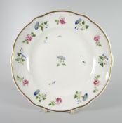 A NANTGARW PORCELAIN PLATE of lobed form and painted with sprigs of flowers, possibly by Billingsley