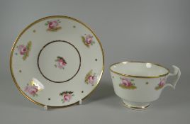 A SWANSEA PORCELAIN TEA CUP & SAUCER with thick curvaceous ogee handle, the rims picked out in