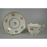 A SWANSEA PORCELAIN TEA CUP & SAUCER with thick curvaceous ogee handle, the rims picked out in