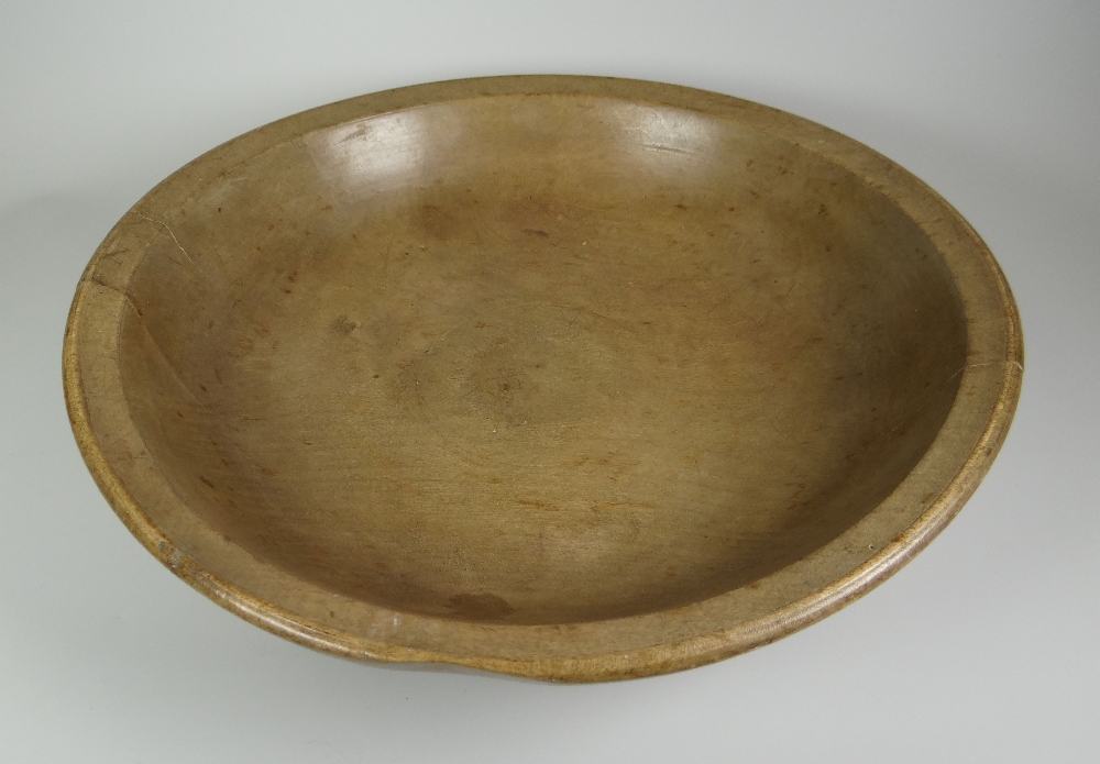 A SYCAMORE WELSH DAIRY BOWL with turned rim, 35cms diam
