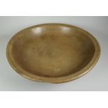 A SYCAMORE WELSH DAIRY BOWL with turned rim, 35cms diam