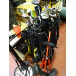 Excellent quantity of golf clubs and manual trollies