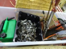 Plastic tub of wormdrive clips, mitre saw and other associated garage items