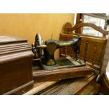 Vintage Singer sewing machine in case and a magazine rack