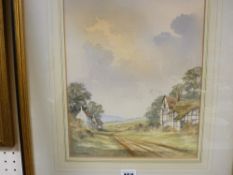 I A GILLIBRAND watercolour - a furrowed track between cottages with sheep to the background