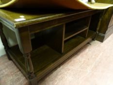 Polished wooden coffee table with centre shelves