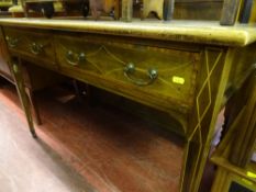 Inlaid mahogany two drawer desk on tapering supports and brown pot castors