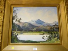 W ROBERTS gilt framed oil on board - waterside view with cattle and possibly Snowdon to the