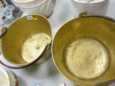 Two vintage brass jampans with iron swing handles