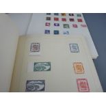 Small stamp collection contained in two volumes
