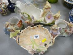 Four Austrian biscuit porcelain maidens with flowers ornaments
