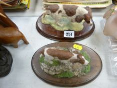 Country Artist model of a spaniel and one other