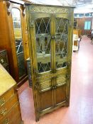 A PRIORY STYLE OAK CORNER CUPBOARD with leaded lattice glass doors, 170 cms high, 72 cms wide