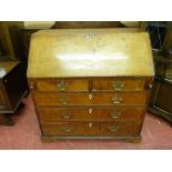 A GEORGIAN OAK BUREAU (alterations), 104.5 cms high, 100 cms wide, 55 cms deep