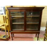 A GOOD VICTORIAN MAHOGANY SLIDING DOOR BOOKCASE on stand, 154.5 cms high, 144 cms wide, 38 cms