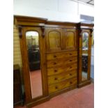 A VICTORIAN MAHOGANY INVERTED BREAKFRONT COMBINATION WARDROBE, 209 cms high, 240 cms wide, 65 cms