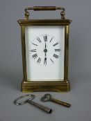 A BRASS CASED CARRIAGE CLOCK with visible platform escapement, 17.5 cms high top of handle