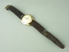 A NINE CARAT GOLD CASED GENT'S OMEGA WRISTWATCH with leather strap and crown winder (appears