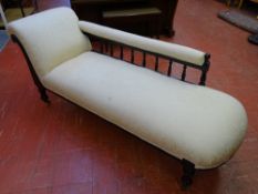 A GOOD EBONIZED EDWARDIAN CHAISE LONGUE with modern upholstery, 75 cms maximum height, 180 cms long,