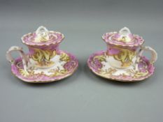 A PAIR OF PINK & GILT INKPOTS WITH COVERS, 7.5 cms high, 11 cms diameter, no maker's marks