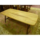 A LIGHT WOOD ERCOL COFFEE TABLE with base rack shelf, 104 x 46 cms