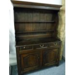 AN 18th CENTURY WELSH OAK DRESSER of neat proportions, 190 cms high, 132 cms wide, 52 cms deep