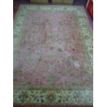 AN INDO KESHAN ROSE & CREAM GROUND INDIAN WOOL PILE CARPET, 365 x 273 cms