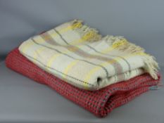 TWO VINTAGE WOOLLEN BLANKETS including a waffle weave in red and blue with tasselled ends