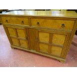 A VINTAGE OAK SIDEBOARD with burr walnut veneer drawer fronts and door panels on corner bracket