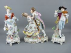 THREE SITZENDORF CLASSICALLY STYLED FIGURINES in bright colours on gilt highlighted Rococo bases,