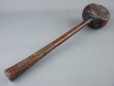 A 19th CENTURY FIJI WOODEN THROWING CLUB with chip carved handle decoration, 38 cms long