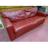 A STYLISH RED LEATHER EFFECT DOUBLE SOFA BED, 190 cms long, 90 cms deep