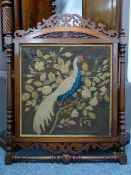 A VICTORIAN MAHOGANY FRAMED WOOLWORK PANEL, 109.5 cms high, 88 cms wide