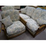 AN ERCOL BERGERE & UPHOLSTERED THREE PIECE LOUNGE SUITE, 84 cms high, 188 cms wide the couch