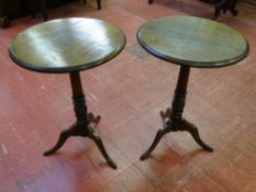 A PAIR OF REPRODUCTION OAK TRIPOD WINE TABLES, 45 cms diameter, 64.5 cms high (Care! - loose top