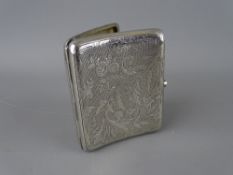 A SILVER CIGARETTE CASE with chased decoration, Birmingham 1894, 3.1 troy ozs, 9 cms long