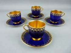 FOUR COALPORT GILT INTERIOR COFFEE CUPS AND SAUCERS, cobalt ground with gilt highlighting, factory