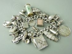 A TWENTY SIX CHARM BRACELET, two silver fobs and a keywind open faced pocket watch marked 'Fine