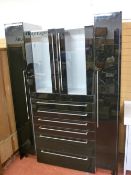 A STYLISH BLACK HIGH GLOSS FOUR PART KITCHEN STORAGE SYSTEM with soft-glide drawers and stainless