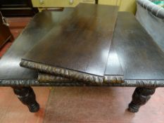 A VICTORIAN JACOBEAN STYLE OAK EXTENDING DINING TABLE with two extra leaves, 73.5 cms high, 135 x