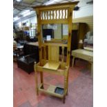 A VINTAGE BLONDE OAK MIRRORED HALLSTAND, 199 cms high, 93 cms wide overall, 27.5 cms deep