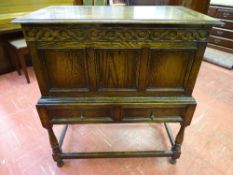 A VINTAGE OAK LIDDED CHEST ON STAND with twin frieze drawers on turned supports, 96 cms high, 84.5