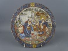 A GOOD JAPANESE SATSUMA POTTERY DISH, jewelled and painted with figures and a three toed dragon in