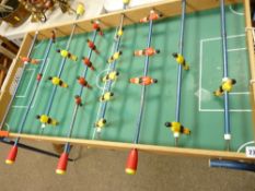 Tabletop football game on fold-out metal legs