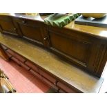 Polished wood sideboard of three upper cupboards and a bank of six lower drawers