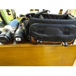 Canon EOS 300 camera and lens in carry bag