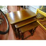 Polished wood nest of three coffee tables