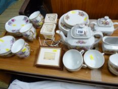 Continental floral china teaset, an Oriental rose patterned teaset, two small cream ware reticulated